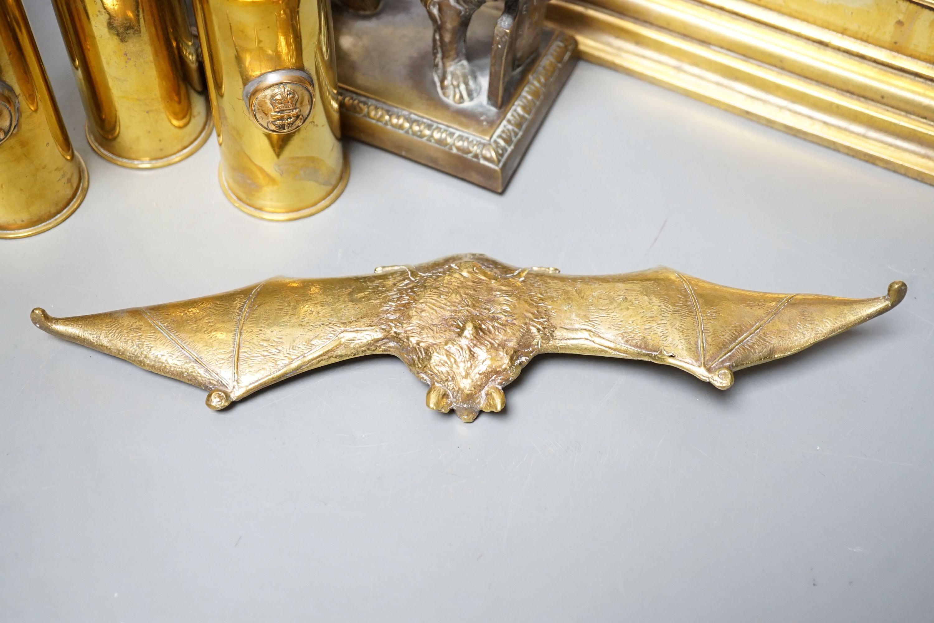 A brass ‘bat’ pin tray, two lion figures and sundry metalware, lion door stop 20 cms height x 25 cms width